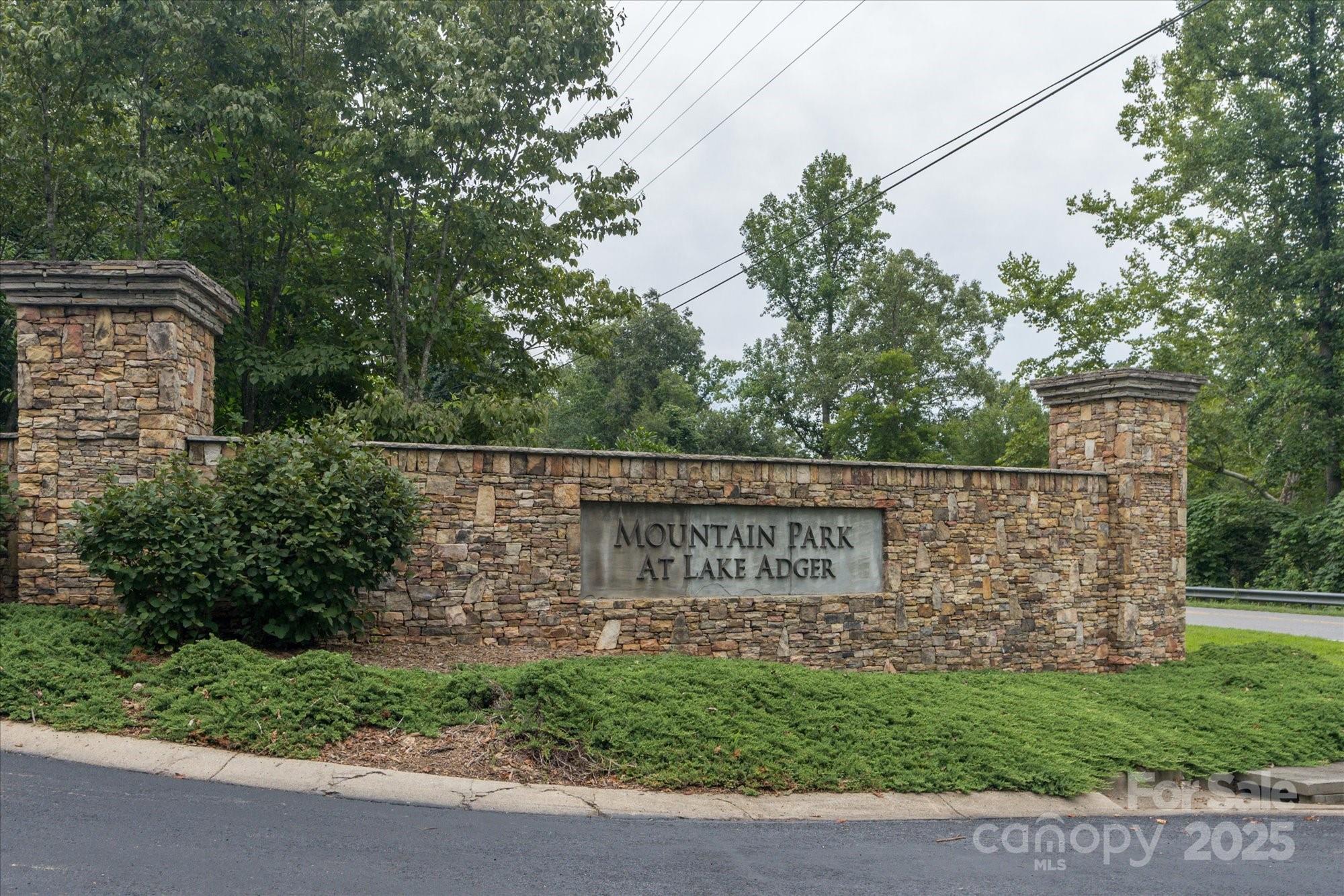 0 Twin Maple Way, Unit 5 Mill Spring, NC 28756 - Photo 8 of 16 a sign on the side of a building