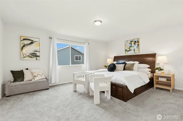 a bedroom with a bed and a couch