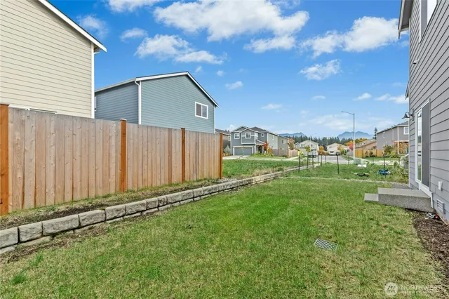 a backyard of a house with lots of green space