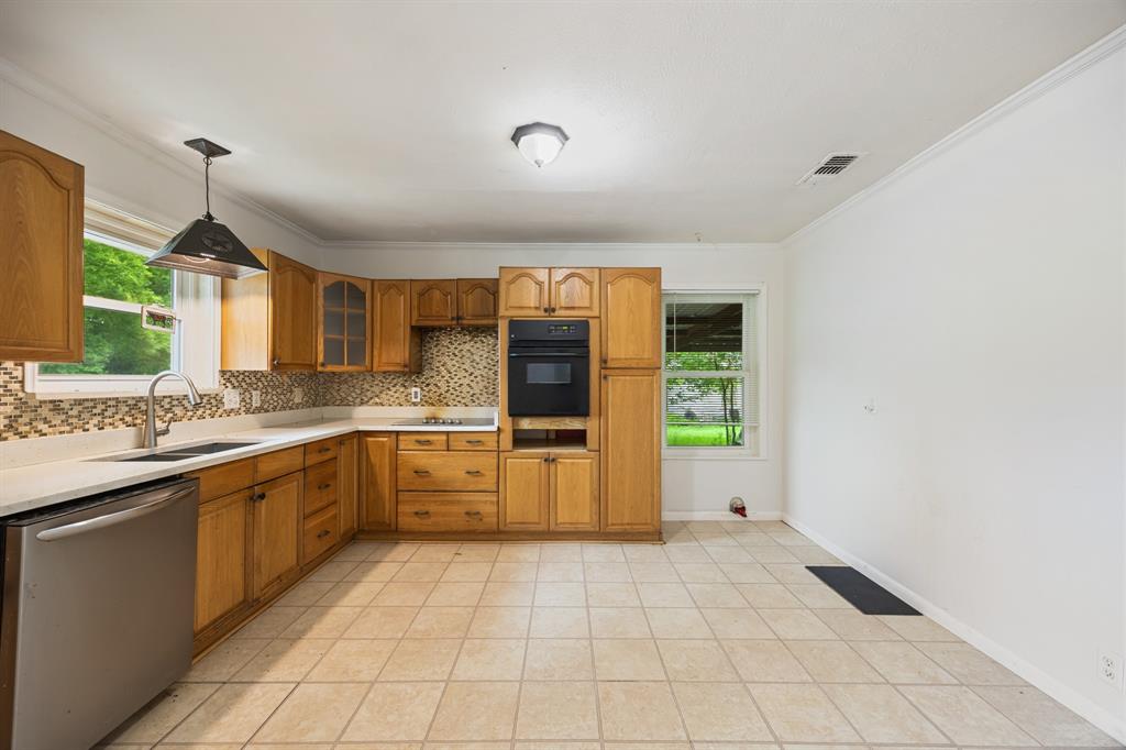 571 South 1st Street Point, TX 75472 - Photo 11 of 27 a large kitchen with a sink and cabinets