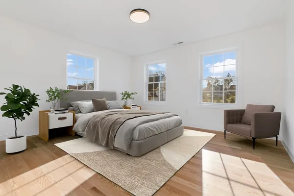 a bedroom with a large bed and a couch