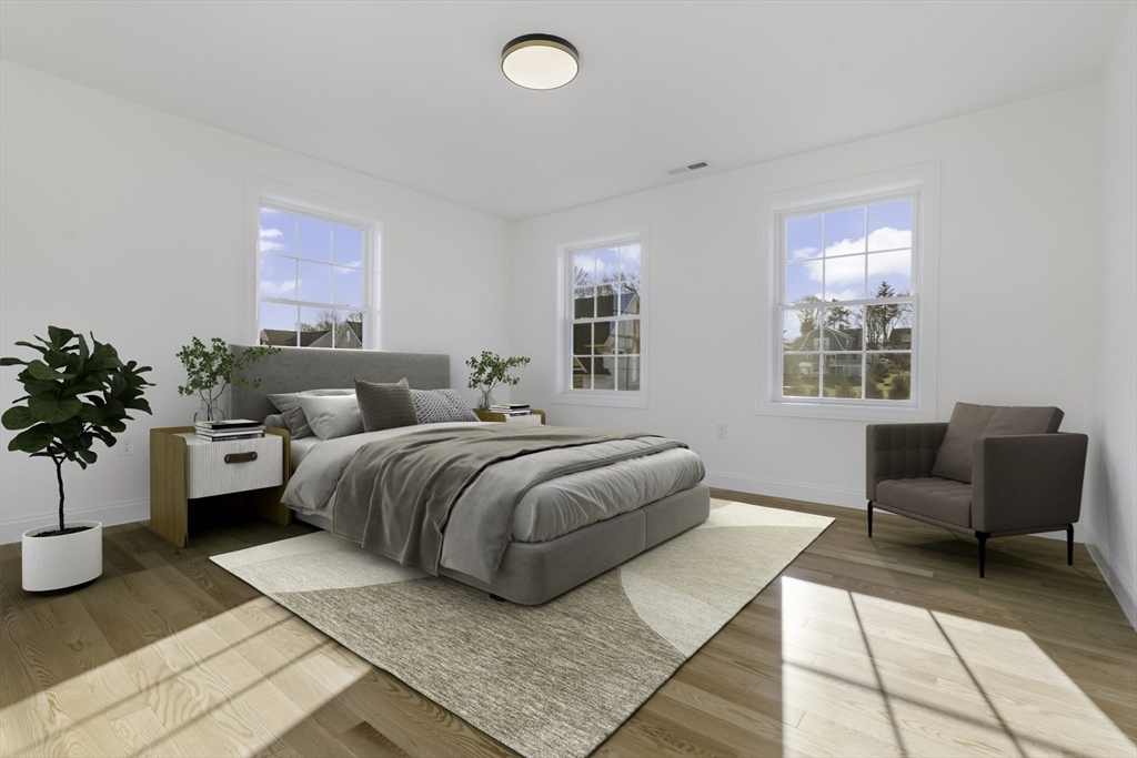 62 High Street, Unit LOT 7 Stoneham, MA 02180 - Photo 13 of 19 a bedroom with a large bed and a couch