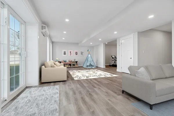 a living room with furniture and a large window