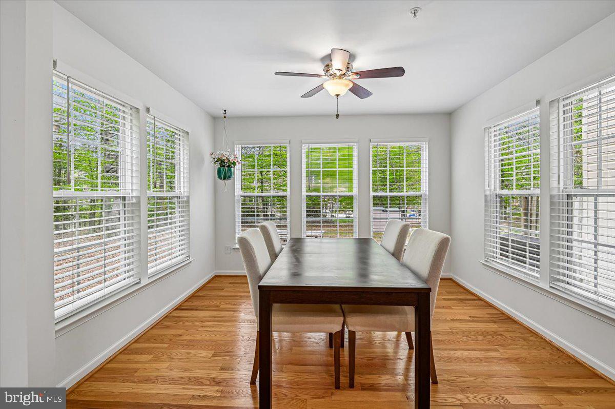 2401 High Brandy Way Odenton, MD 21113 - Photo 13 of 61 a view of a dining room with furniture window and wooden floor