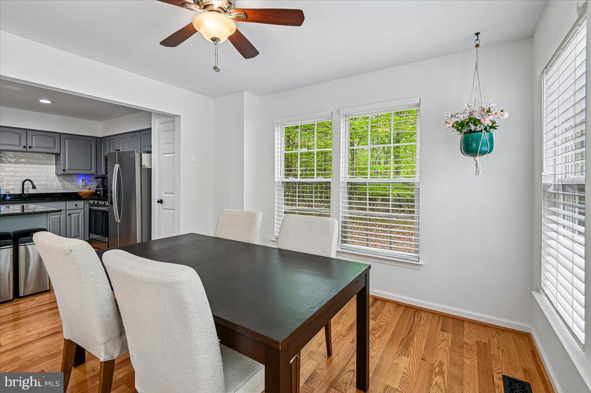 2401 High Brandy Way Odenton, MD 21113 - Photo 15 of 61 a view of a dining room with furniture and window