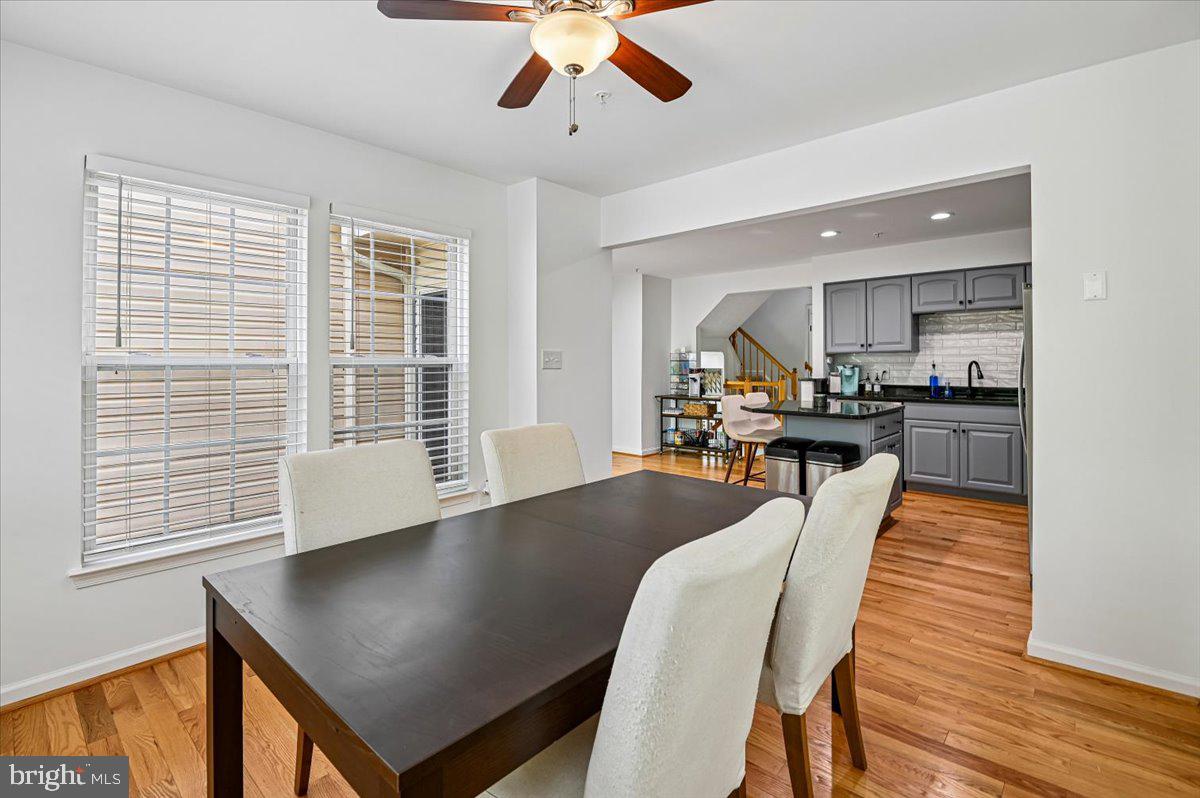 2401 High Brandy Way Odenton, MD 21113 - Photo 16 of 61 a view of a dining room with furniture window and wooden floor