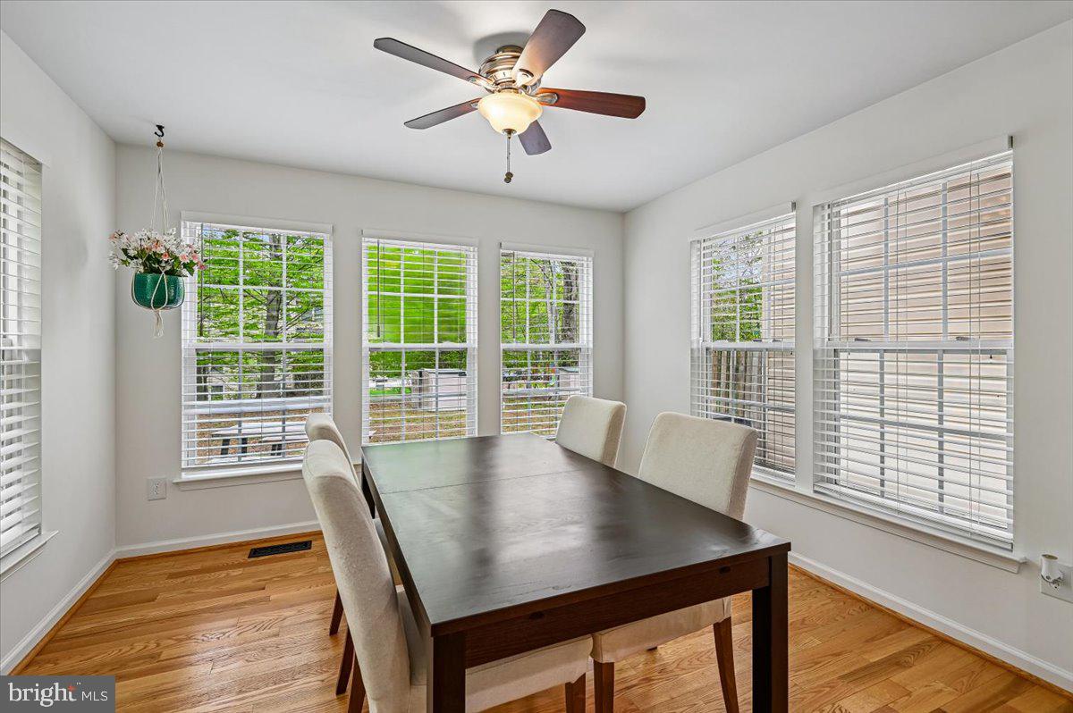 2401 High Brandy Way Odenton, MD 21113 - Photo 17 of 61 a view of a dining room with furniture window and wooden floor