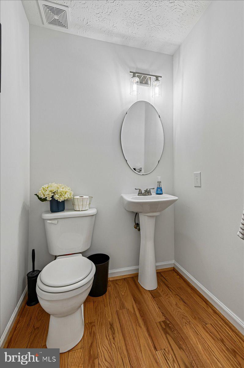 2401 High Brandy Way Odenton, MD 21113 - Photo 18 of 61 a bathroom with a toilet sink and mirror