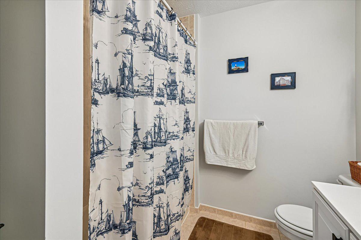 2401 High Brandy Way Odenton, MD 21113 - Photo 31 of 61 a bathroom with a toilet sink and shower curtain