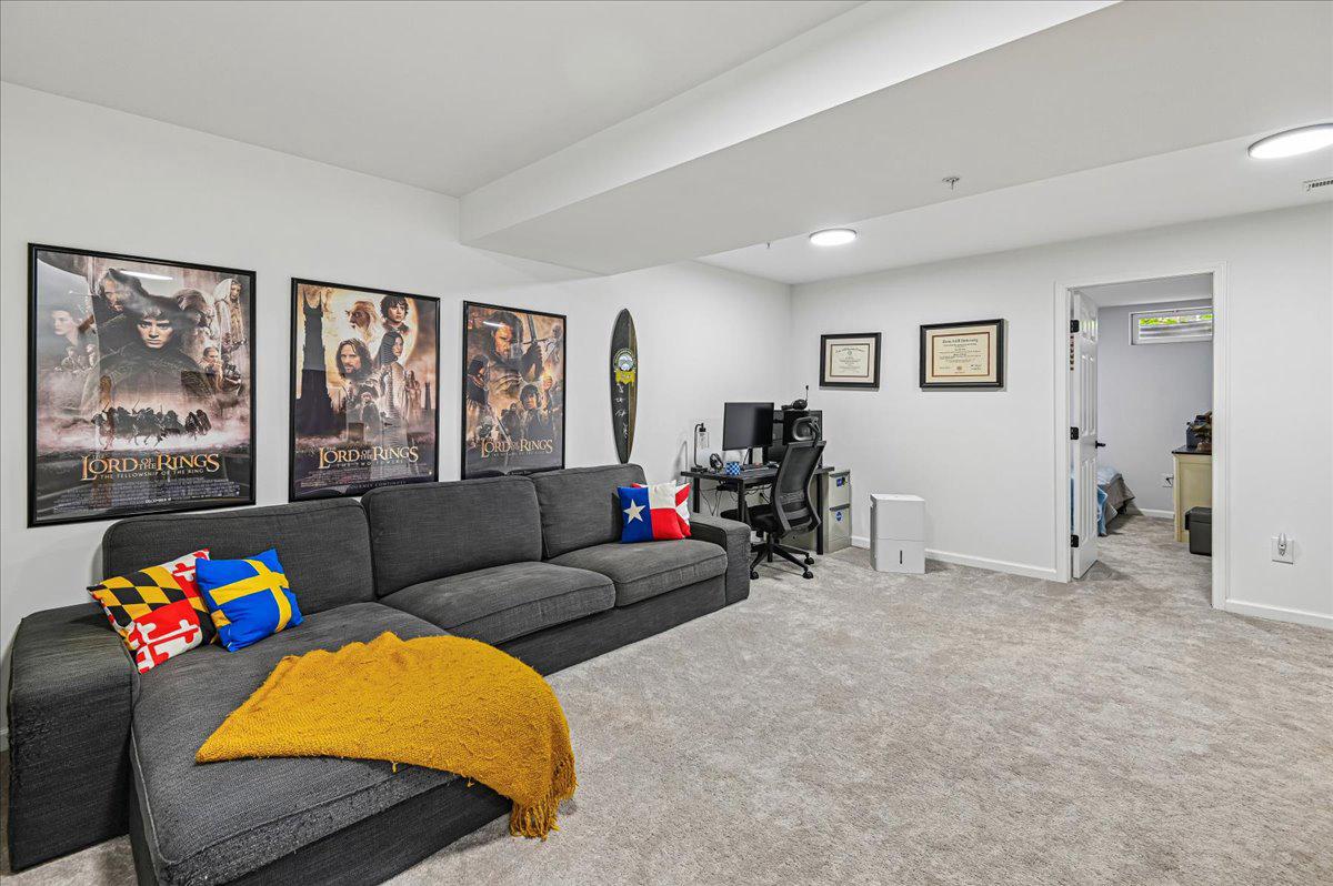 2401 High Brandy Way Odenton, MD 21113 - Photo 33 of 61 a living room with furniture and a flat screen tv