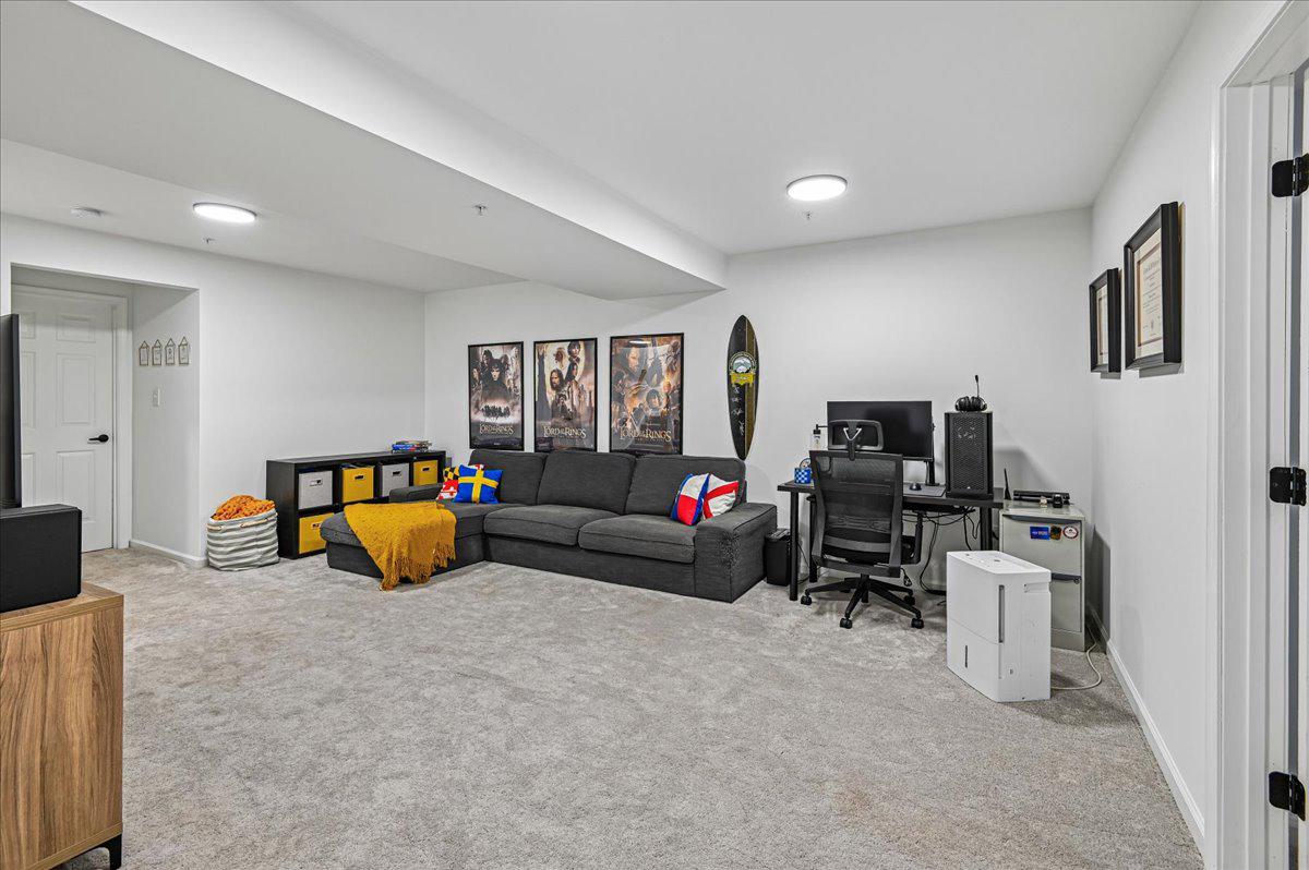 2401 High Brandy Way Odenton, MD 21113 - Photo 34 of 61 a living room with furniture and a flat screen tv