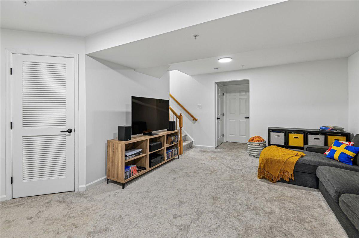 2401 High Brandy Way Odenton, MD 21113 - Photo 35 of 61 a bedroom with furniture and a flat screen tv