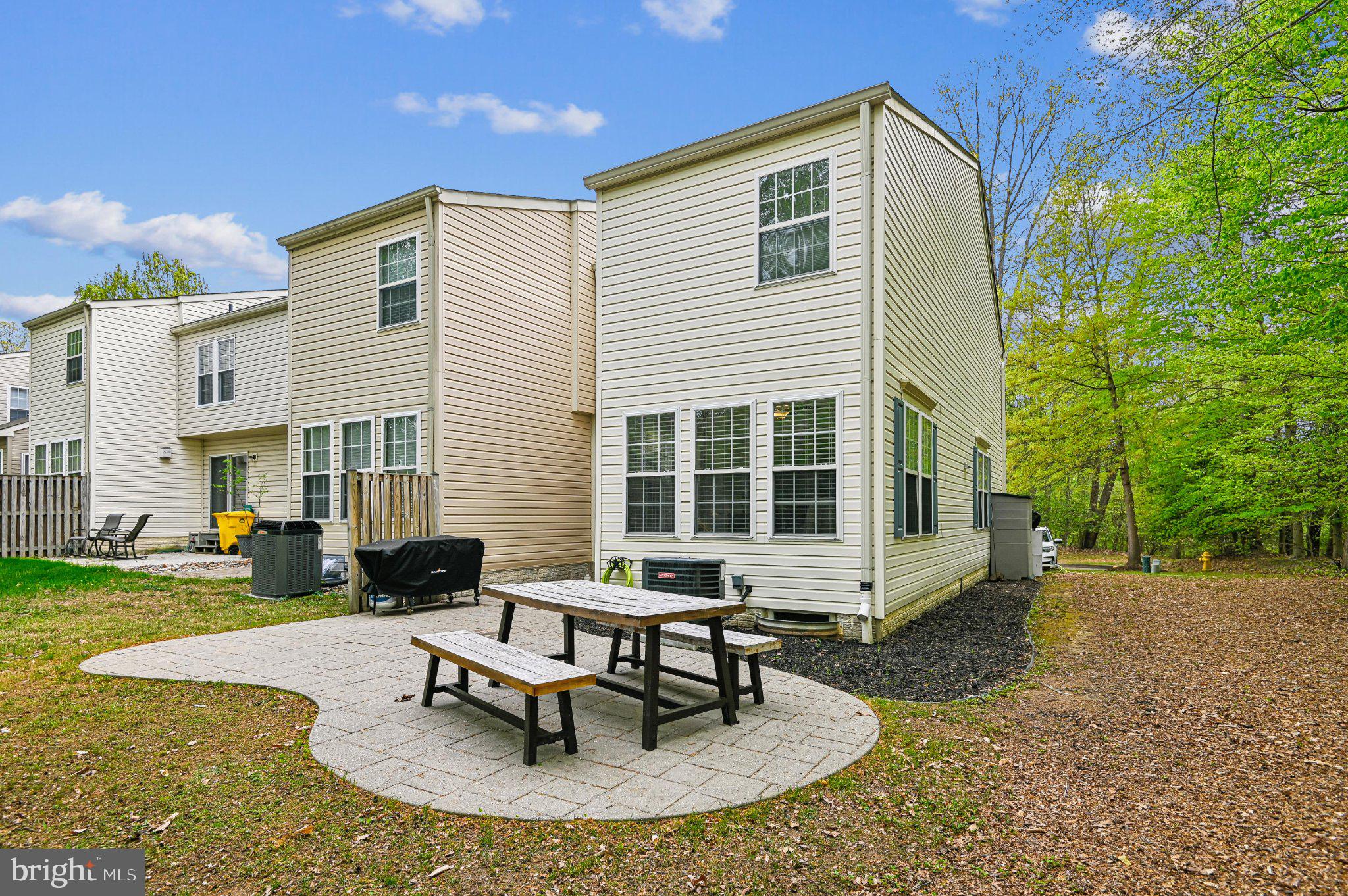 2401 High Brandy Way Odenton, MD 21113 - Photo 46 of 61 a view of a house with backyard sitting area and garden
