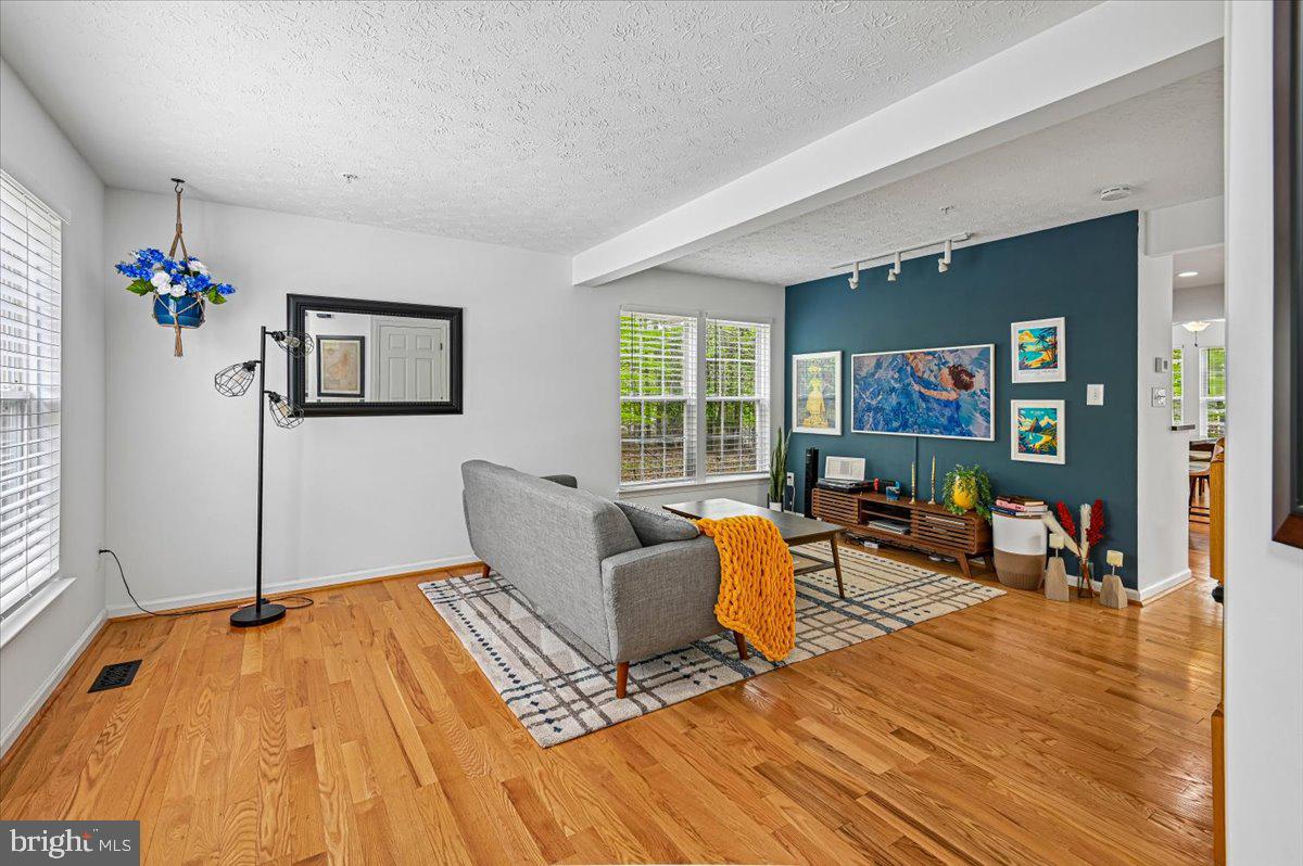 2401 High Brandy Way Odenton, MD 21113 - Photo 5 of 61 a living room with furniture and a wooden floor