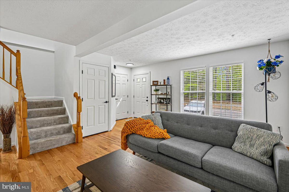 2401 High Brandy Way Odenton, MD 21113 - Photo 8 of 61 a living room with furniture and a large window