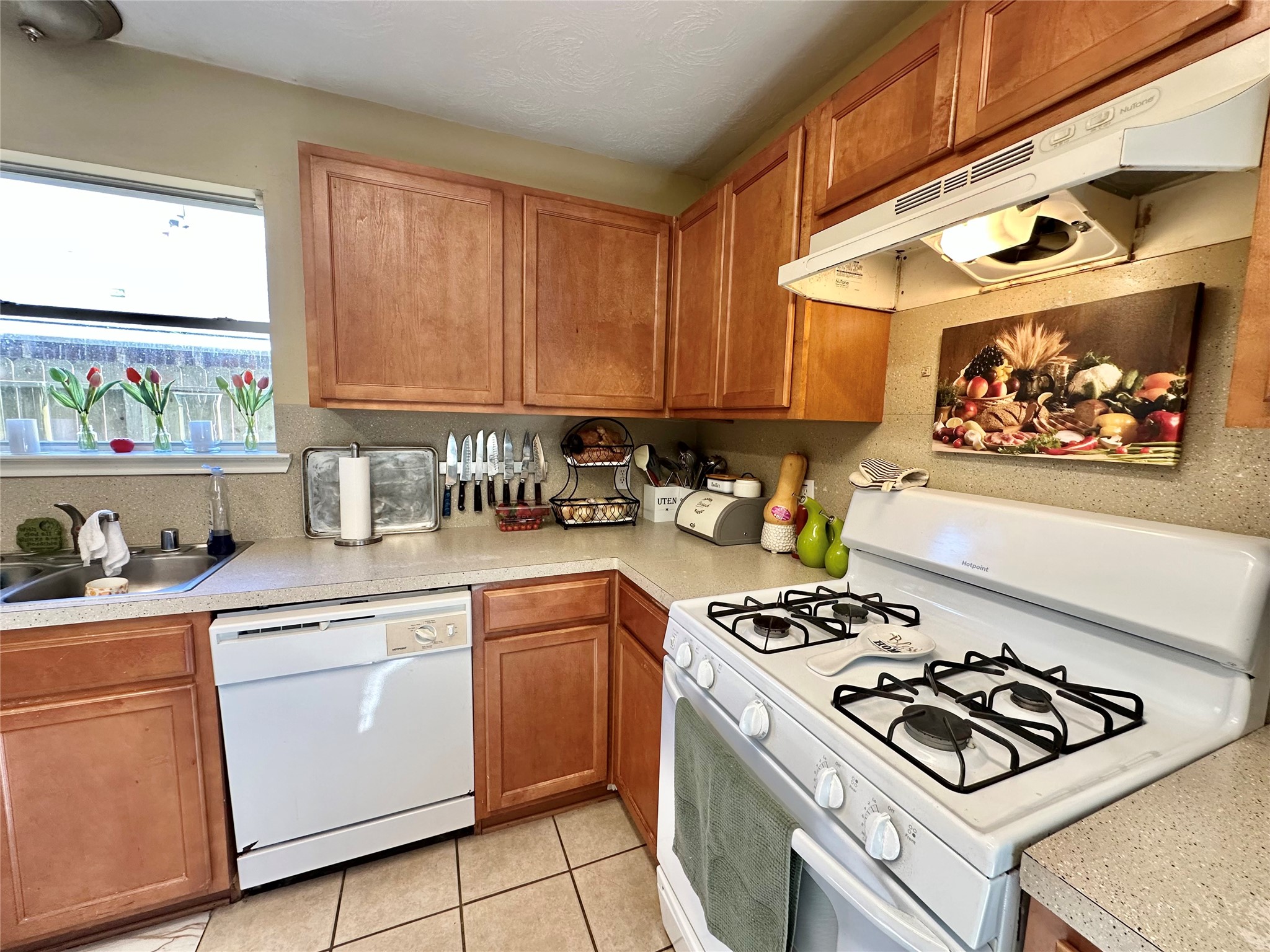 5107 Bright Oak Court Spring, TX 77373 - Photo 6 of 19 a kitchen with a stove and a sink