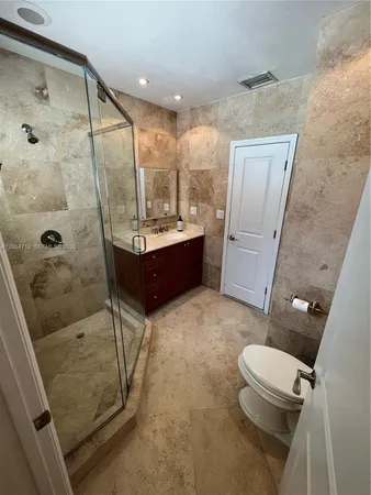 a kitchen with stainless steel appliances granite countertop a refrigerator a stove a sink dishwasher and a microwave