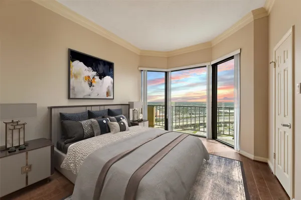 a bedroom with a large bed and a large window