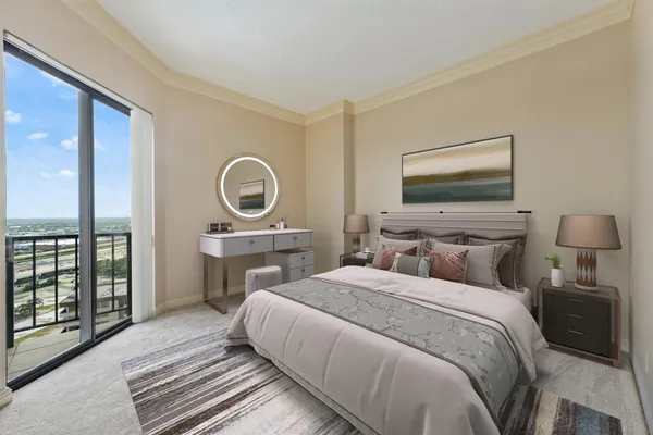 a bedroom with a balcony a bed and a television