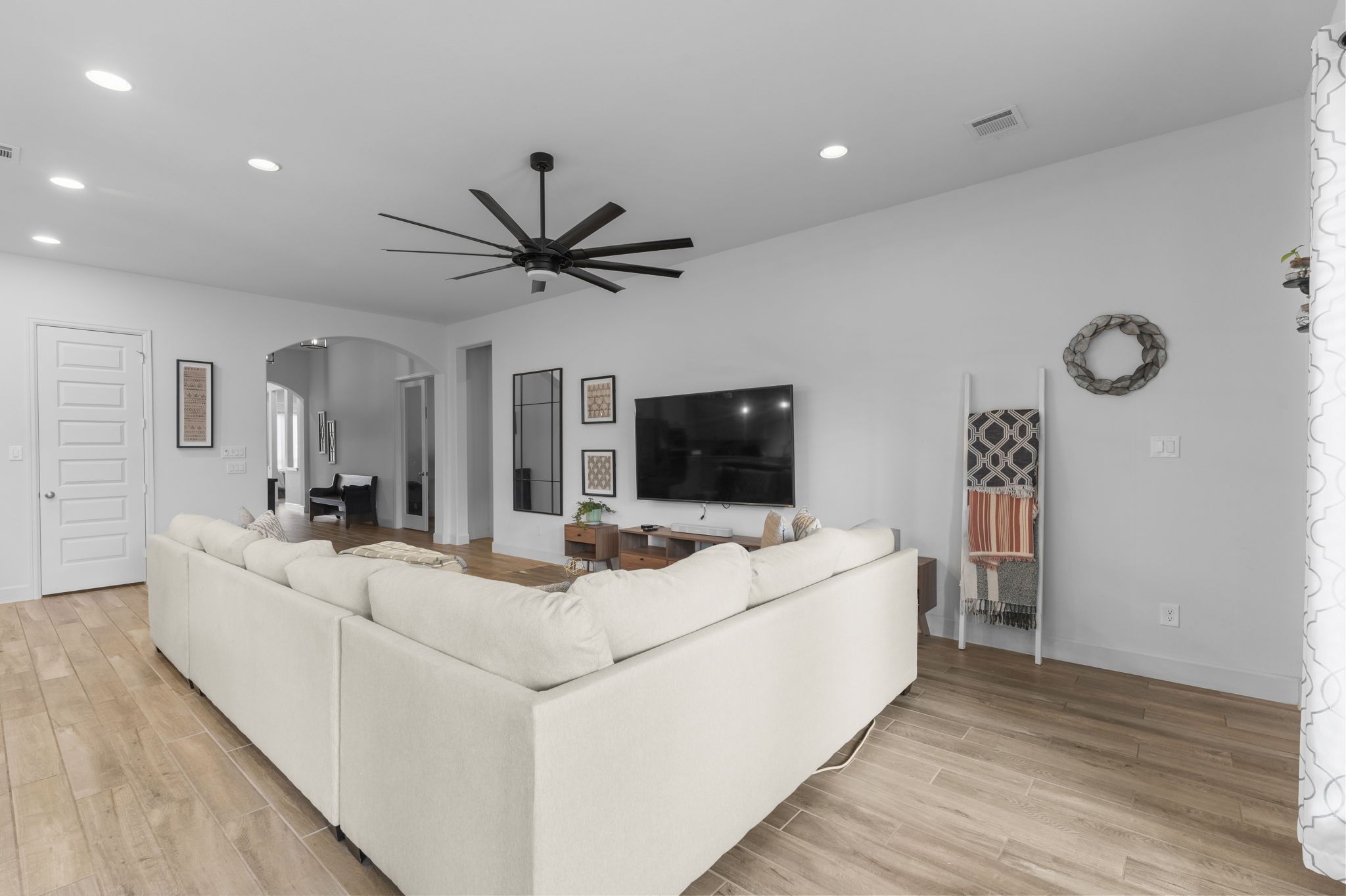 17163 Sandstone Street Conroe, TX 77302 - Photo 11 of 31 a living room with furniture and a flat screen tv