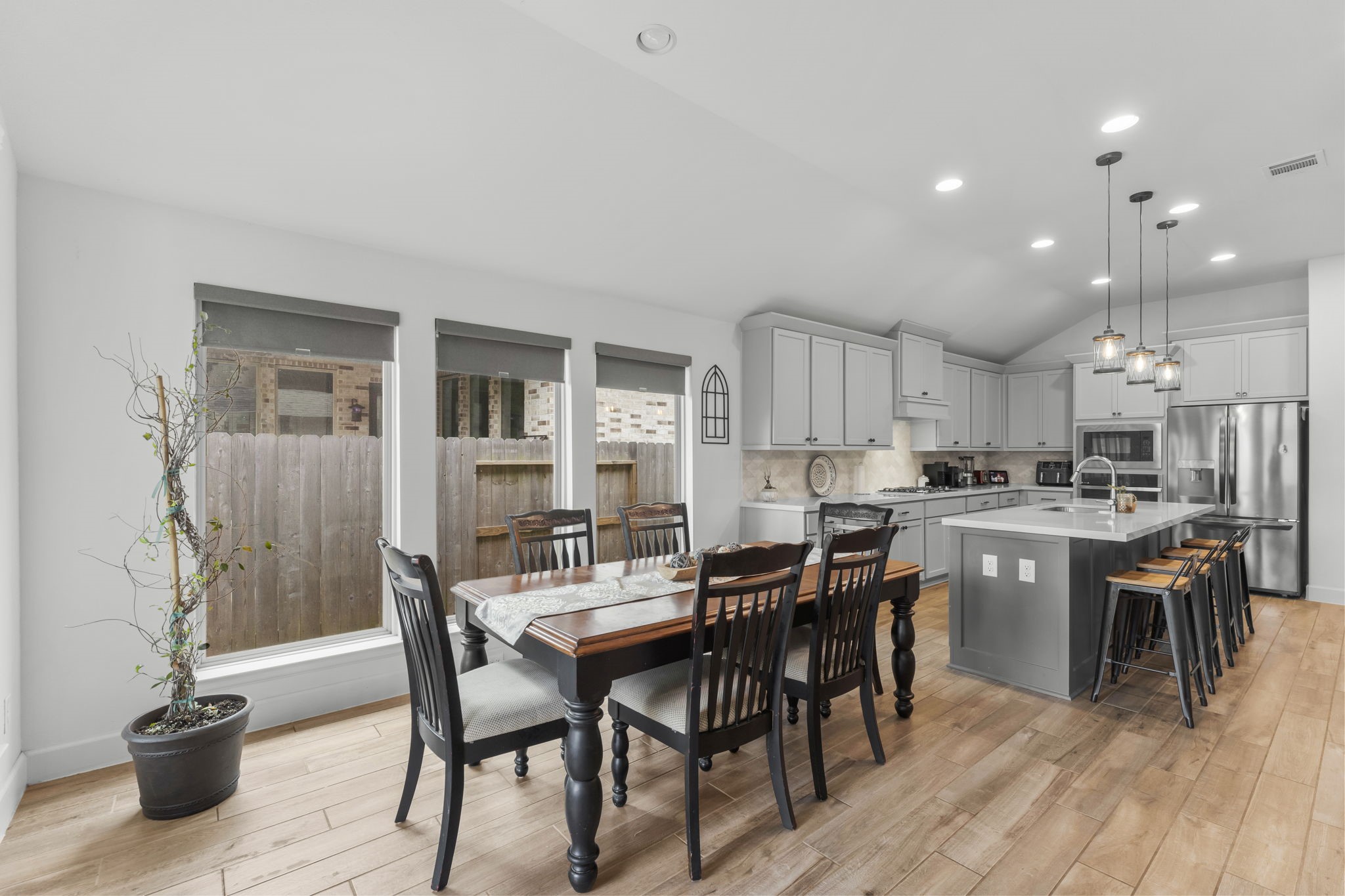 17163 Sandstone Street Conroe, TX 77302 - Photo 13 of 31 a view of a dining room with furniture and wooden floor