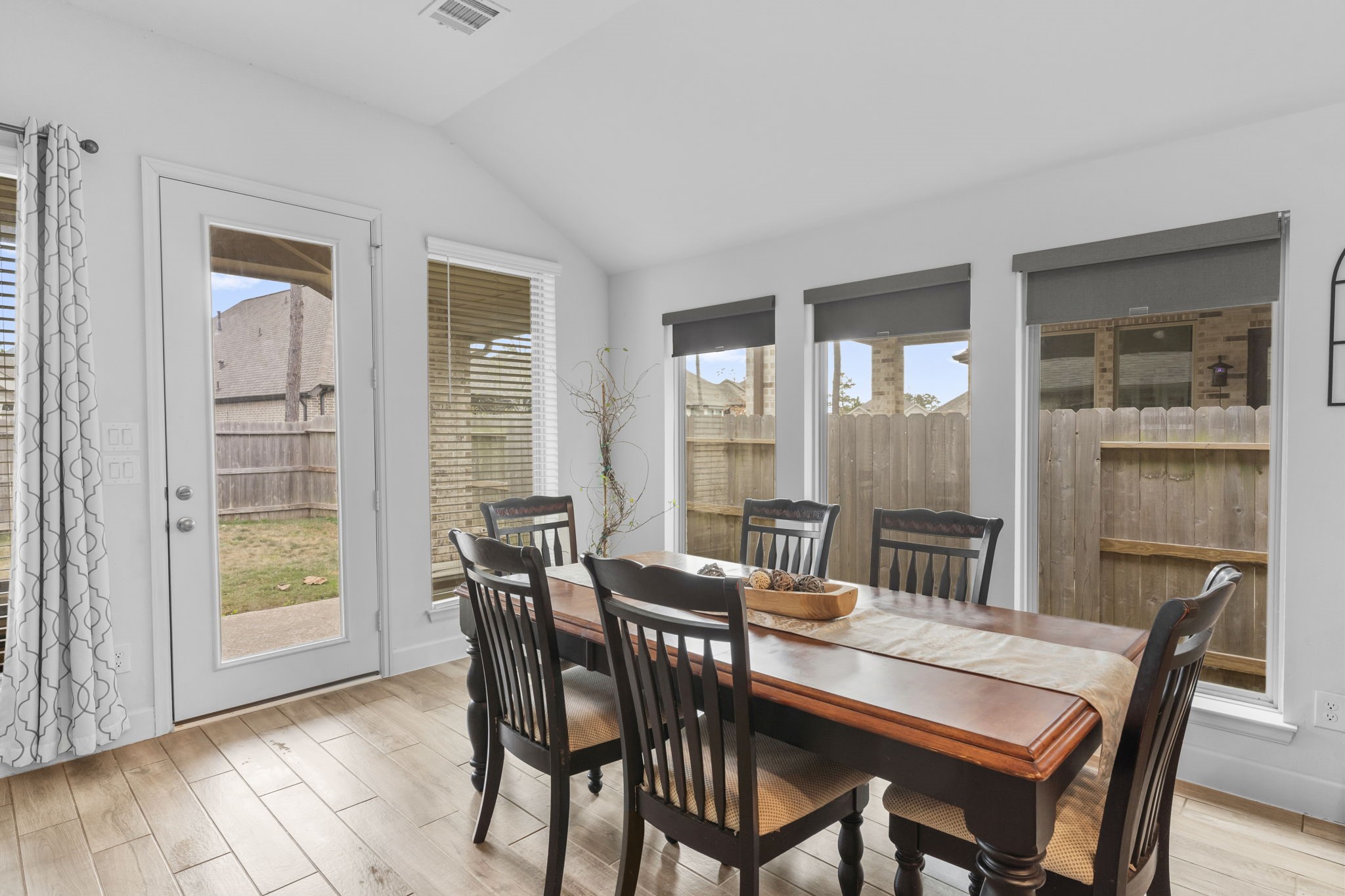 17163 Sandstone Street Conroe, TX 77302 - Photo 14 of 31 a view of a dining room with furniture and a window