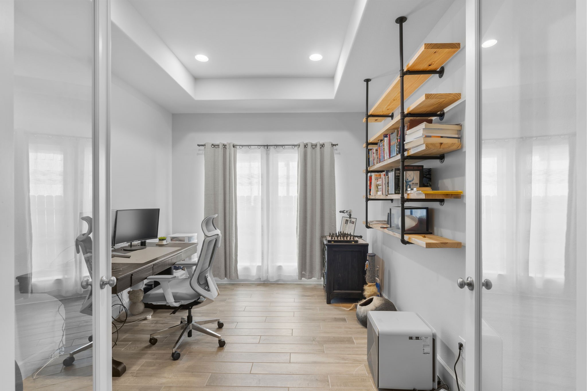17163 Sandstone Street Conroe, TX 77302 - Photo 19 of 31 a view of a workspace with furniture and a window