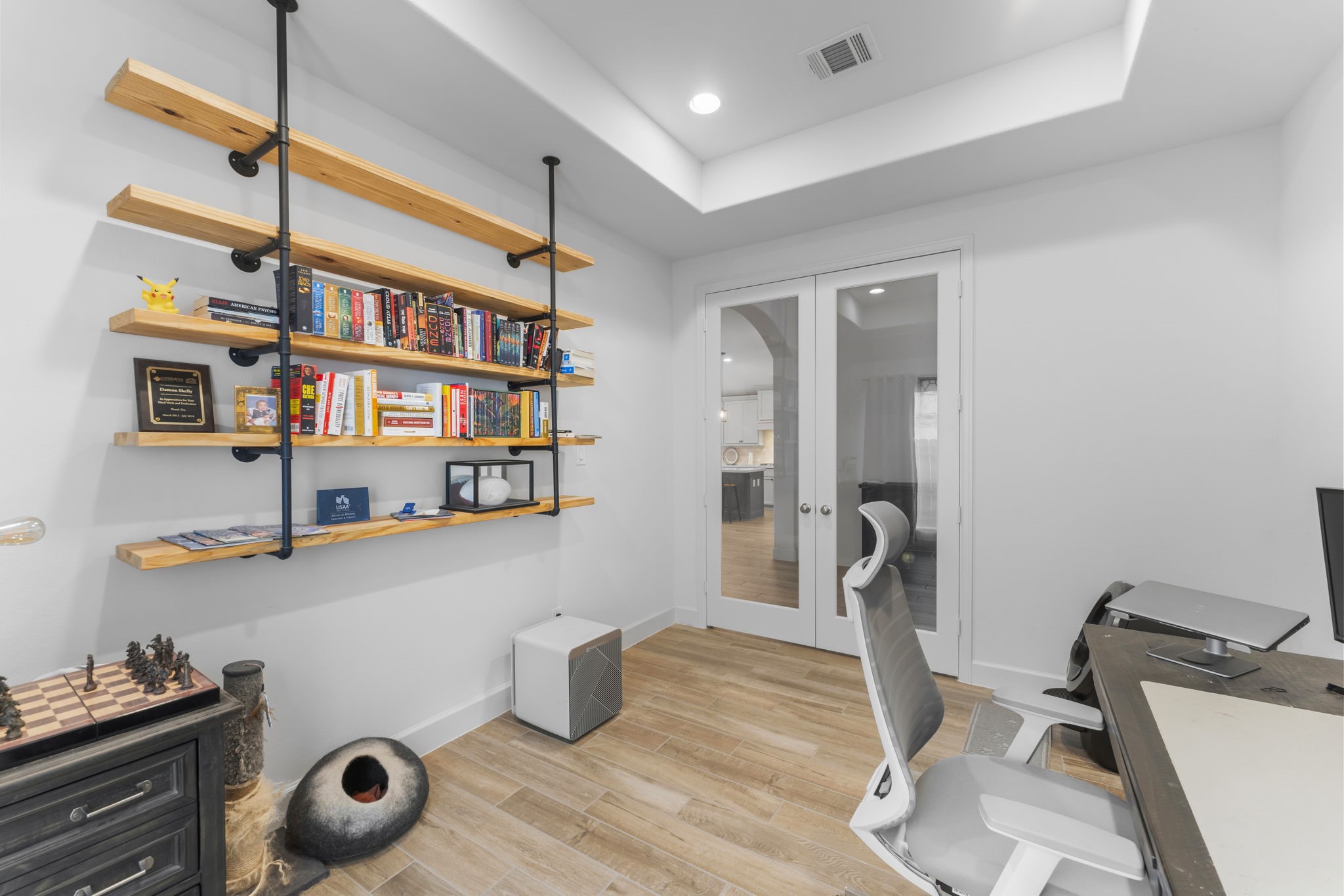 17163 Sandstone Street Conroe, TX 77302 - Photo 20 of 31 a view of a workspace with furniture and wooden floor