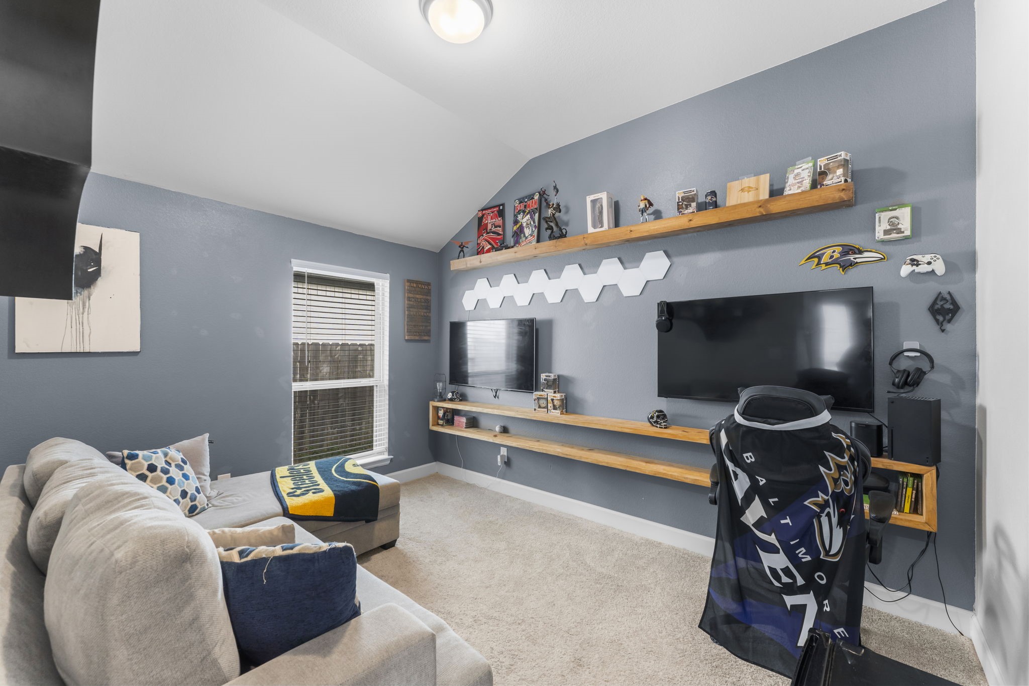 17163 Sandstone Street Conroe, TX 77302 - Photo 4 of 31 a living room with furniture and a flat screen tv
