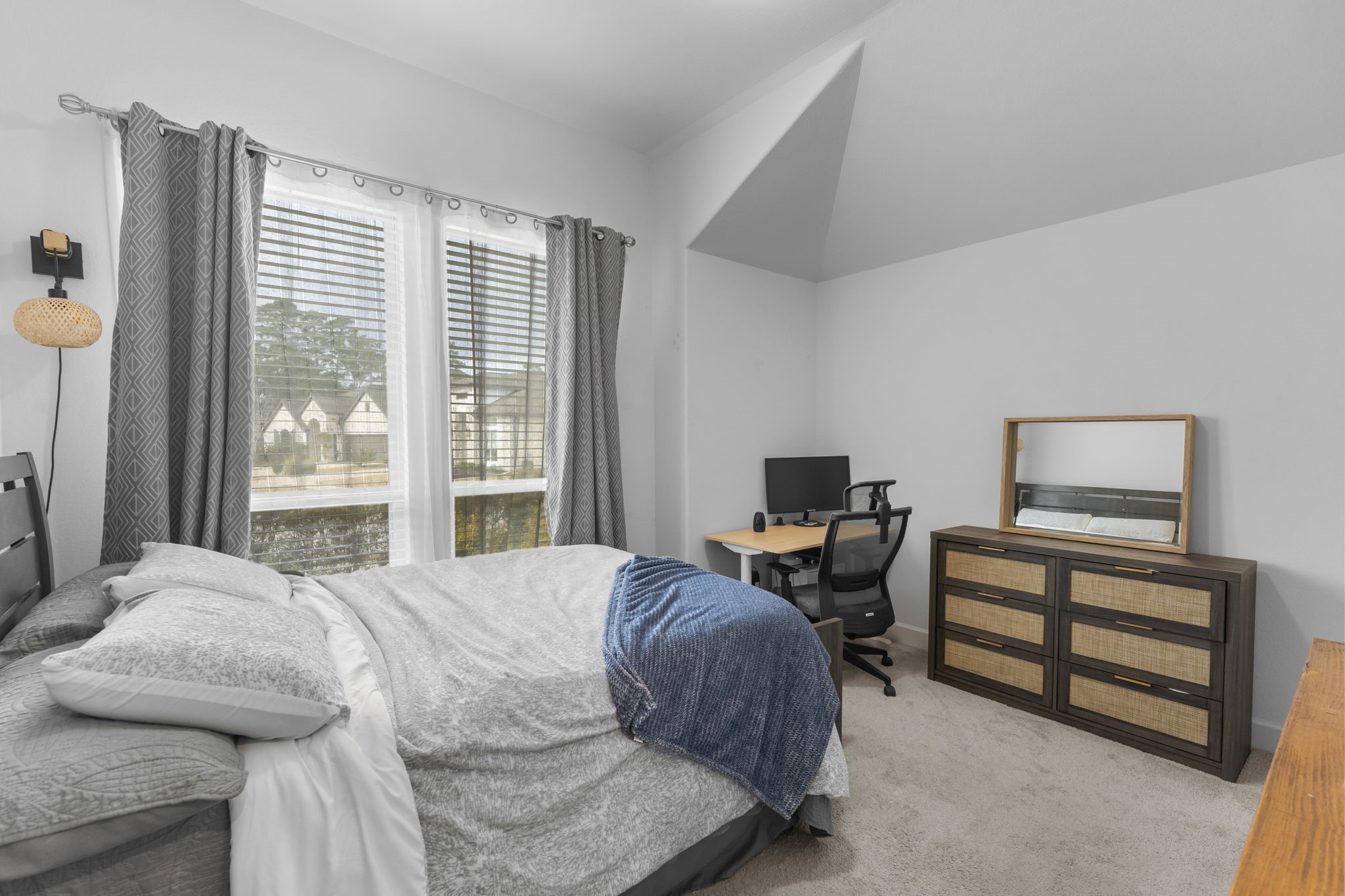 17163 Sandstone Street Conroe, TX 77302 - Photo 6 of 31 a bedroom with a bed and a tv