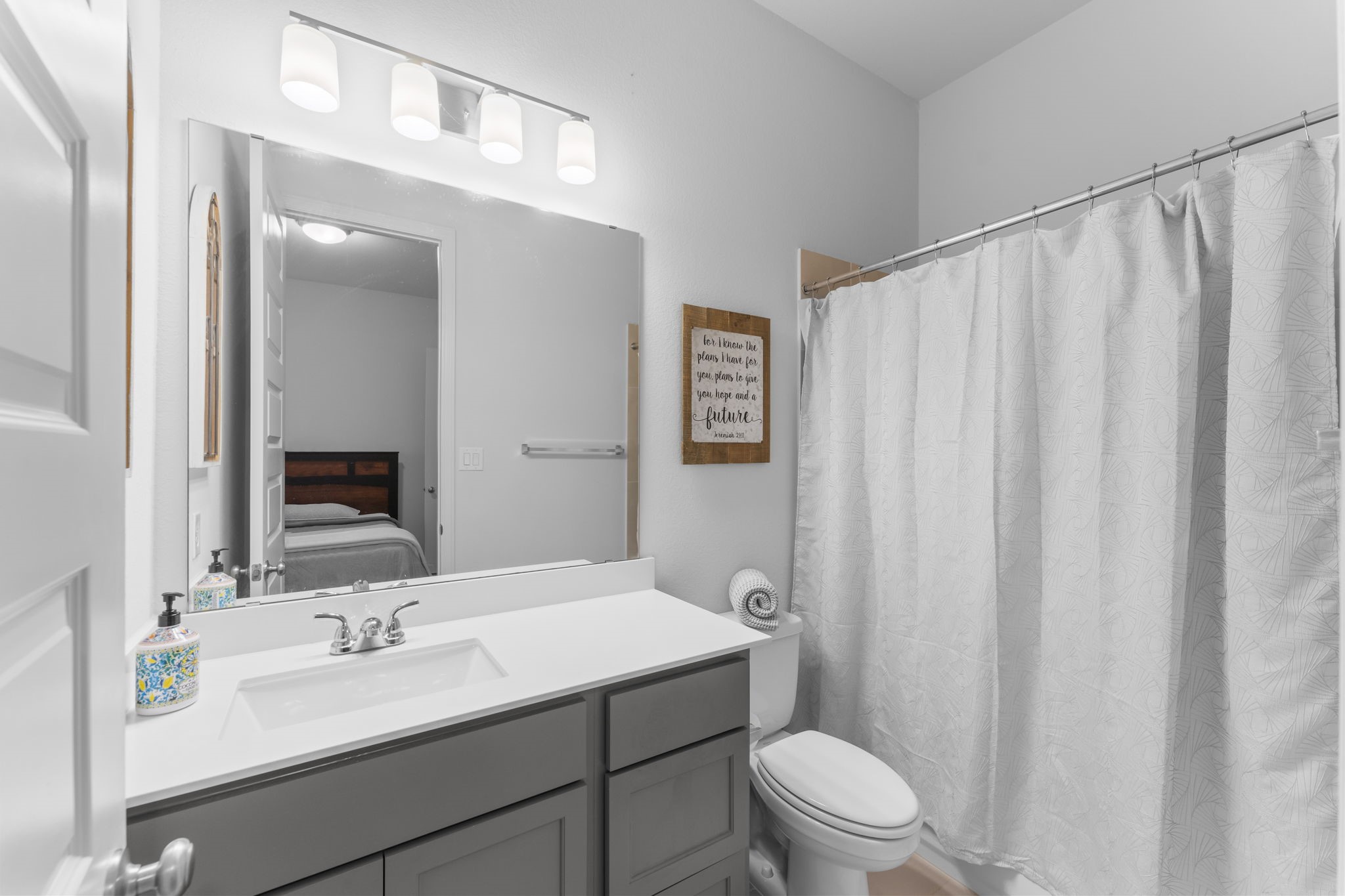 17163 Sandstone Street Conroe, TX 77302 - Photo 9 of 31 a bathroom with a sink a toilet and shower