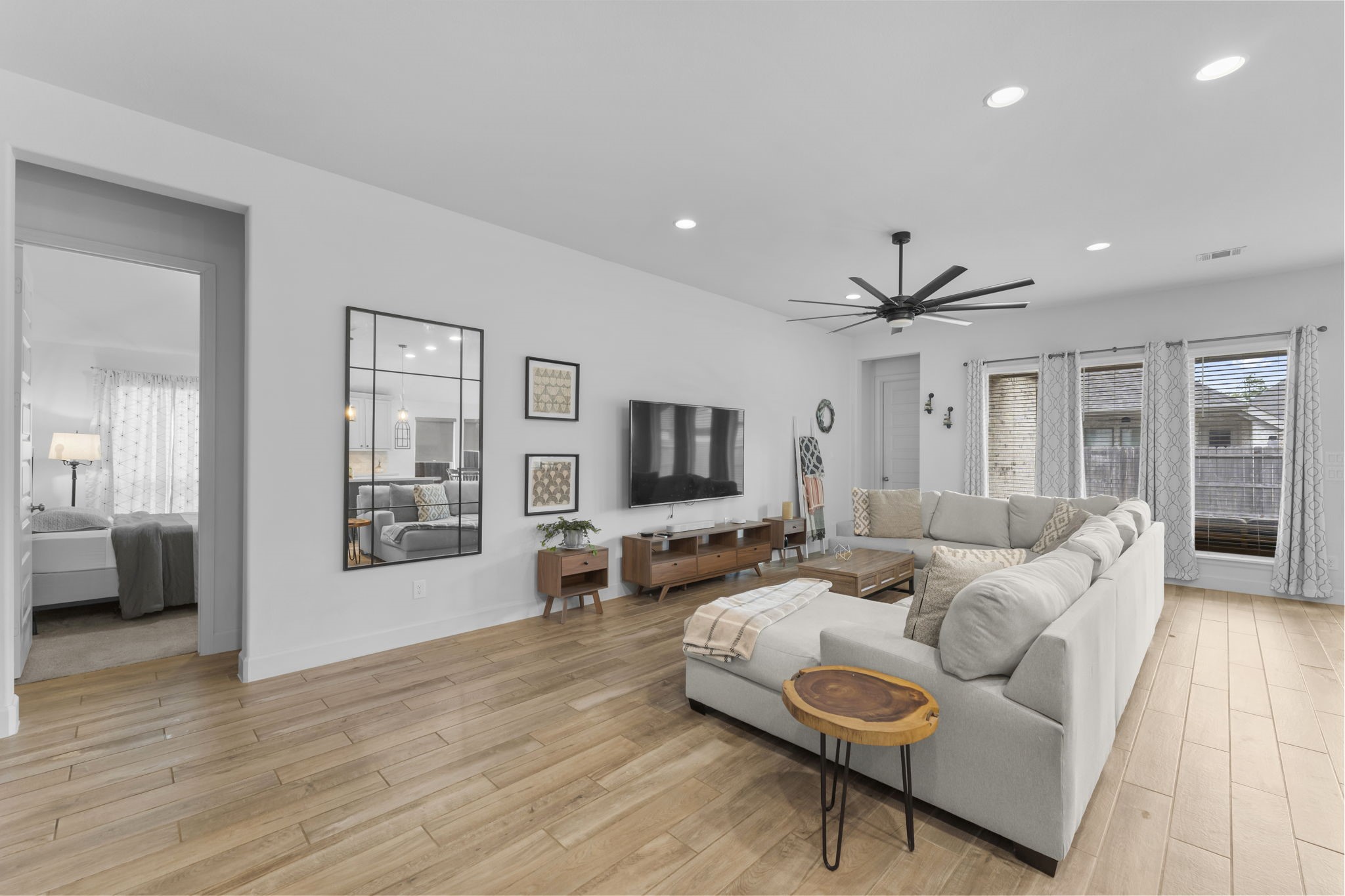 17163 Sandstone Street Conroe, TX 77302 - Photo 10 of 31 a living room with furniture and a flat screen tv