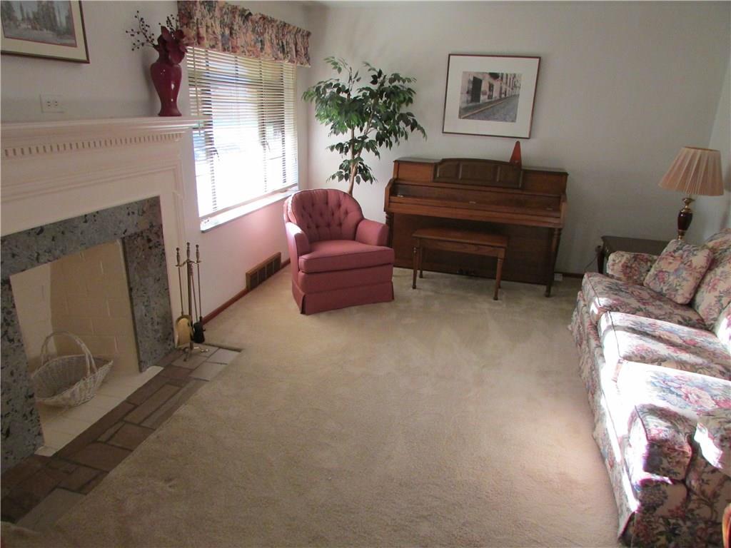 18 Herbst Road Coraopolis, PA 15108 - Photo 3 of 15 Spacious Living Room With Decorator Fireplace Which "May" Be Able To Be Converted Back To Wood Burning FP!