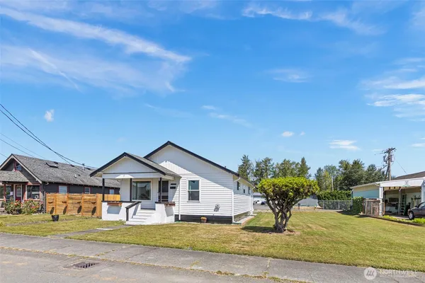 a front view of a house with a yard
