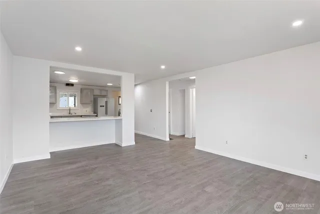 a view of kitchen and kitchen with a sink