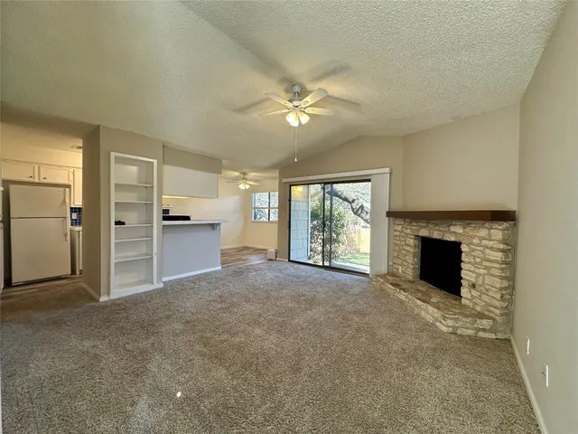 a view of a kitchen with furniture and a fireplace