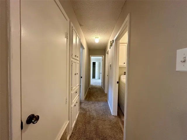 a view of hallway with livingroom