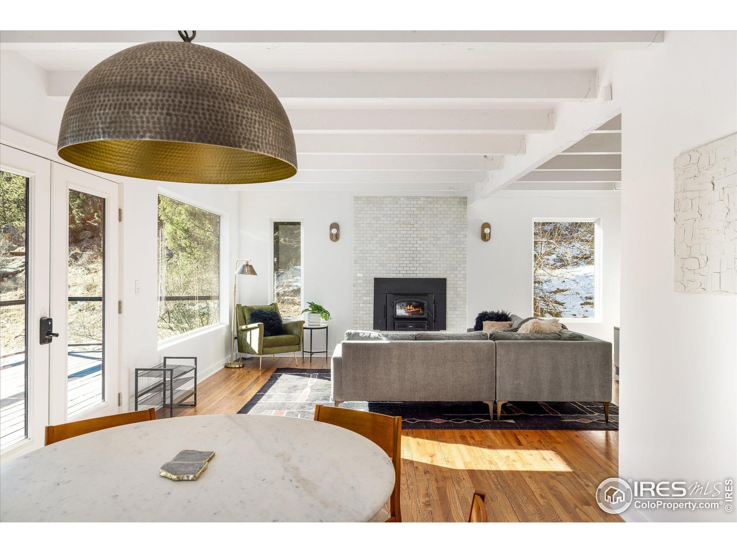 781 Cold Springs Road Boulder, CO 80302 - Photo 2 of 36 a living room with furniture and a fireplace