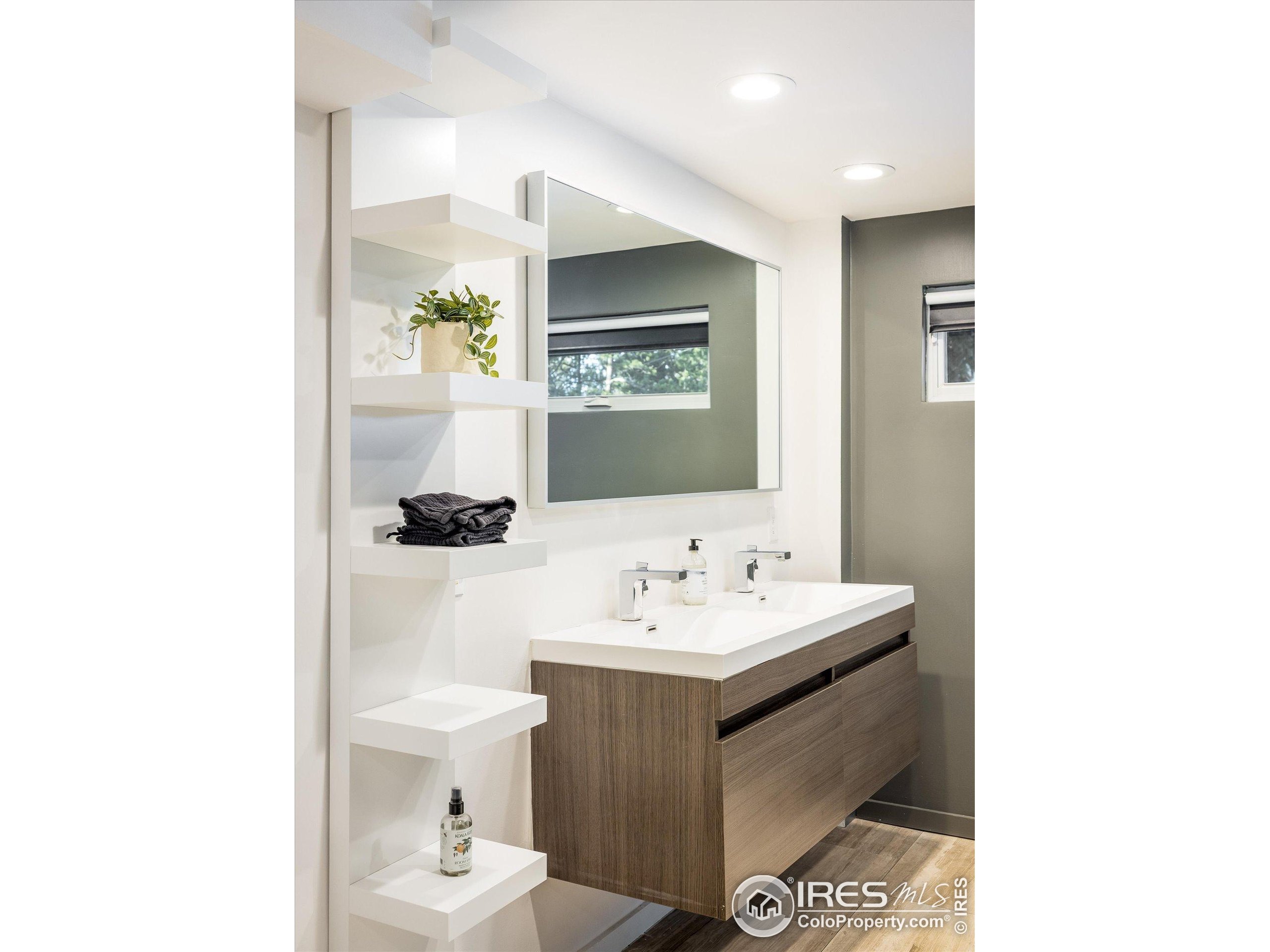 781 Cold Springs Road Boulder, CO 80302 - Photo 25 of 36 a bathroom with a toilet sink and mirror