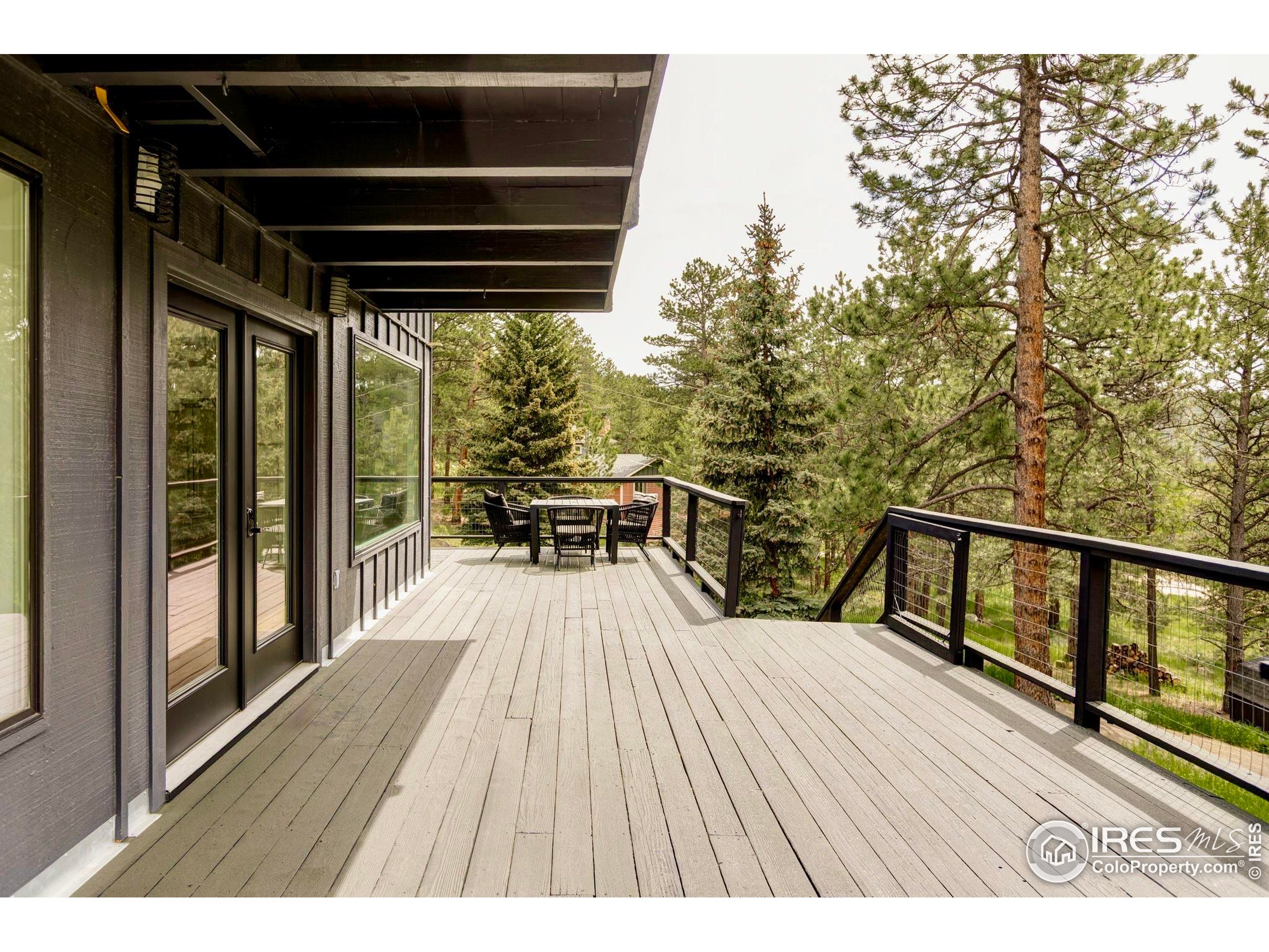 781 Cold Springs Road Boulder, CO 80302 - Photo 29 of 36 a view of balcony with wooden floor and seating space