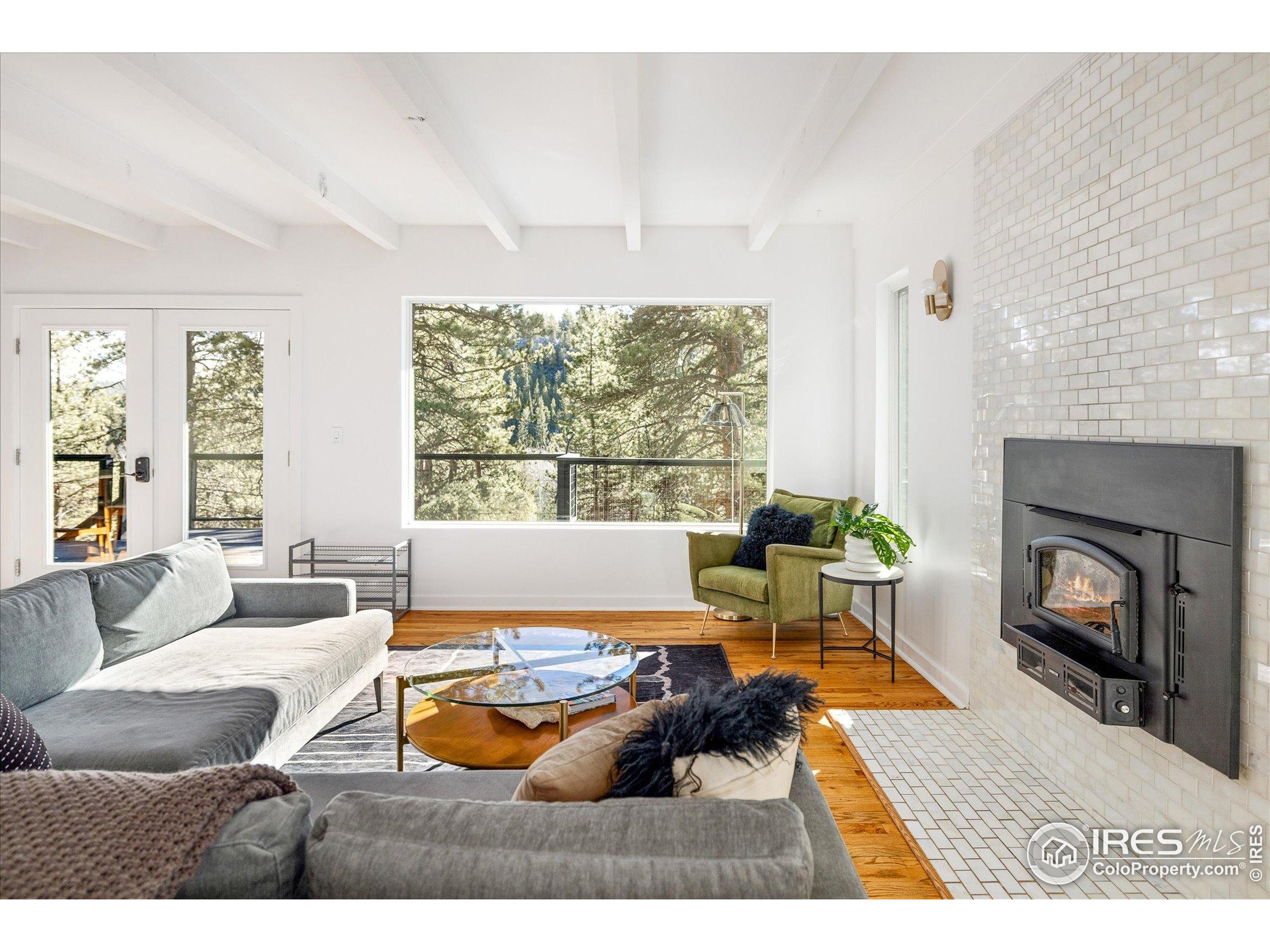 781 Cold Springs Road Boulder, CO 80302 - Photo 8 of 36 a living room with furniture and a fireplace