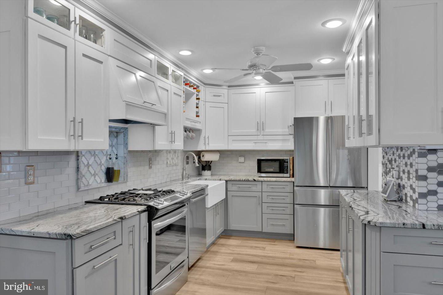 166 Country Farms Road Marlton, NJ 08053 - Photo 14 of 68 a kitchen with kitchen island a sink stainless steel appliances and cabinets