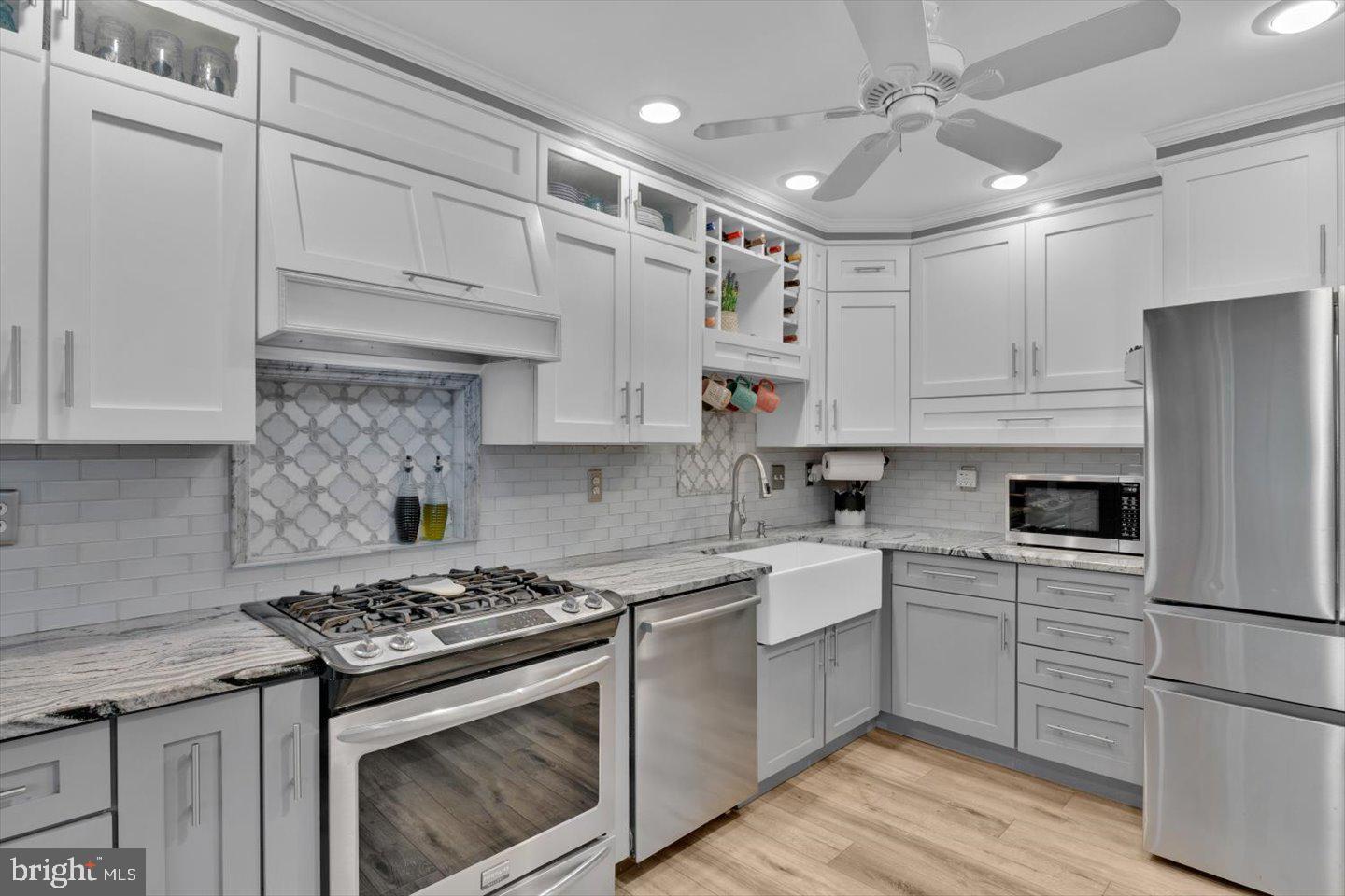 166 Country Farms Road Marlton, NJ 08053 - Photo 15 of 68 a kitchen with cabinets appliances a sink and a counter top space