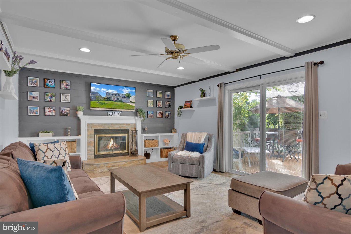 166 Country Farms Road Marlton, NJ 08053 - Photo 24 of 68 a living room with furniture a floor to ceiling window and a flat screen tv