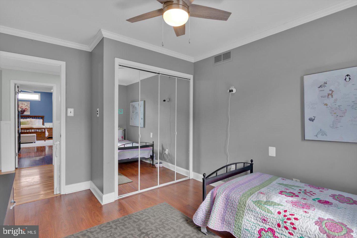 166 Country Farms Road Marlton, NJ 08053 - Photo 45 of 68 a bedroom with a bed and a chandelier