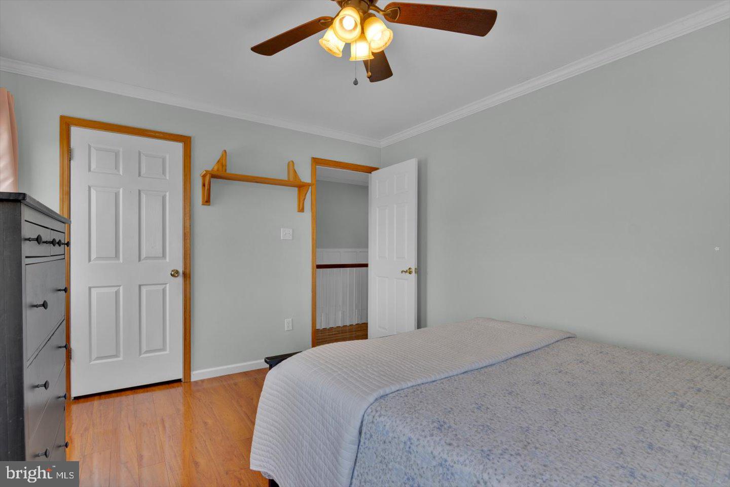 166 Country Farms Road Marlton, NJ 08053 - Photo 50 of 68 a bedroom with a bed and a chandelier