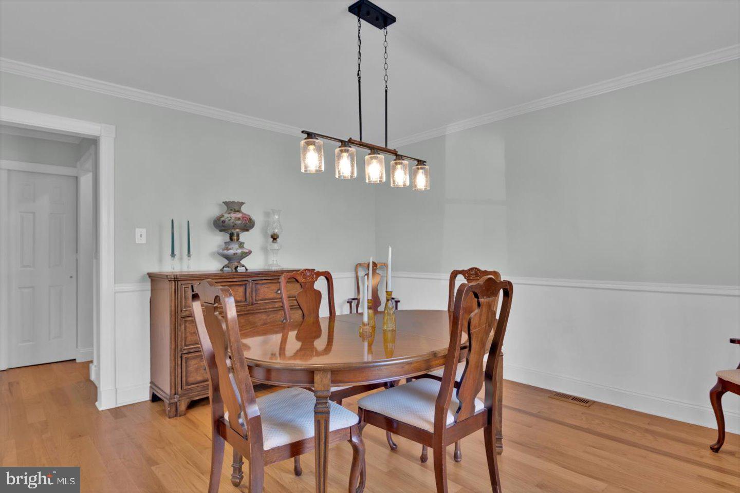 166 Country Farms Road Marlton, NJ 08053 - Photo 8 of 68 a dining room with furniture wooden floor a rug and a chandelier