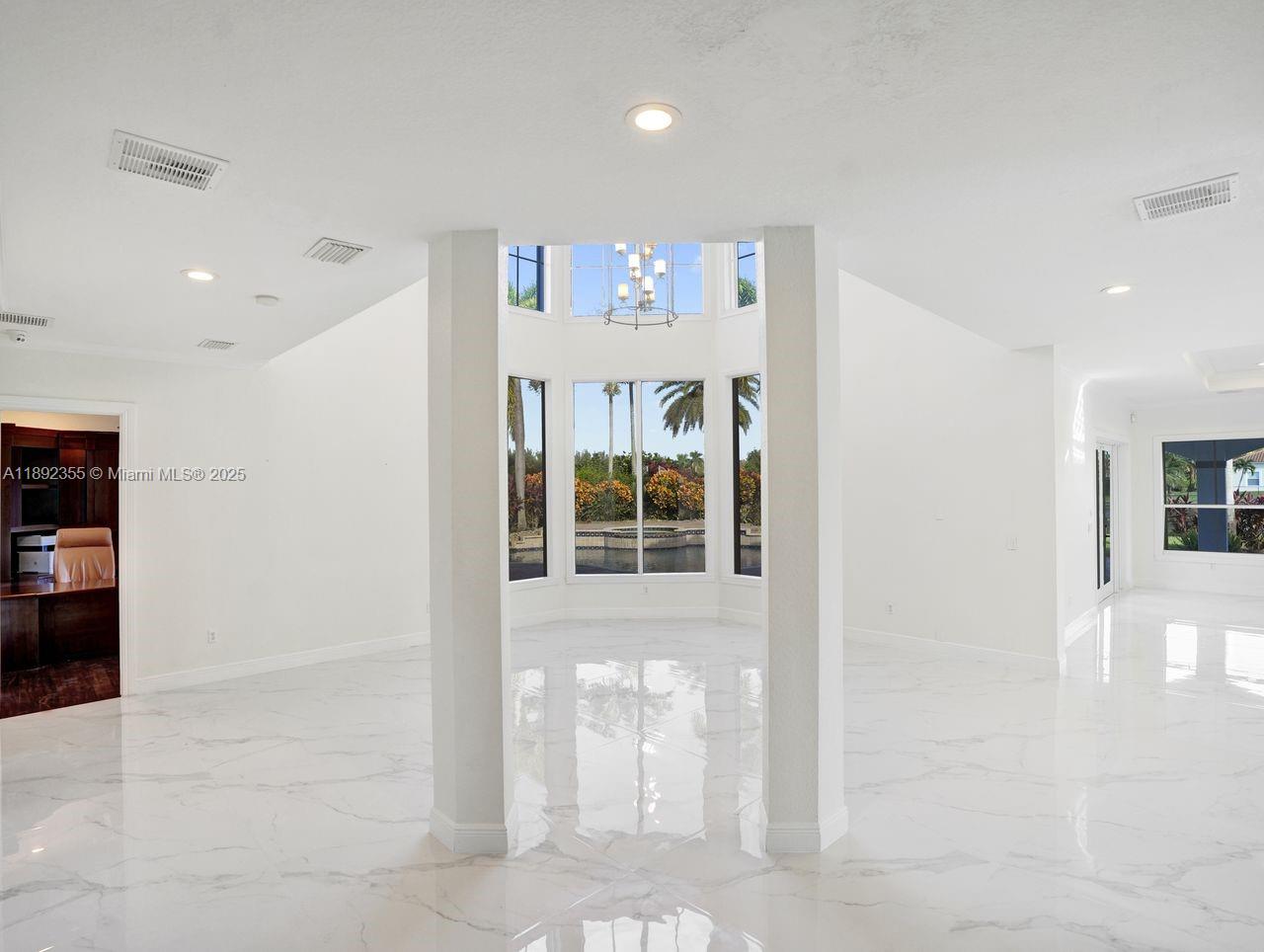 14403 Jockey Circle Davie, FL 33330 - Photo 13 of 53 a view of an entryway with wooden floor