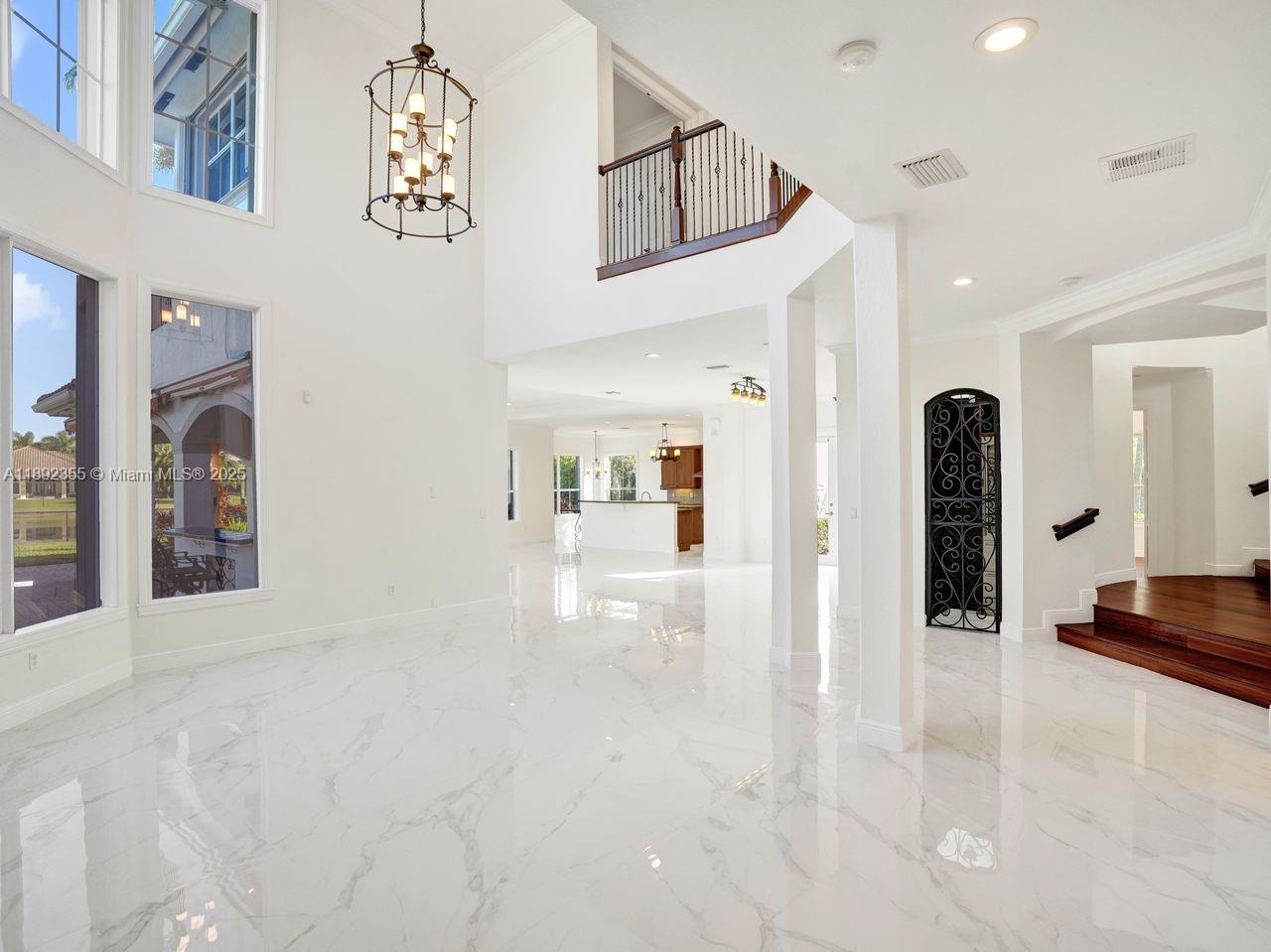 14403 Jockey Circle Davie, FL 33330 - Photo 14 of 53 a view of a hallway with wooden floor and entryway