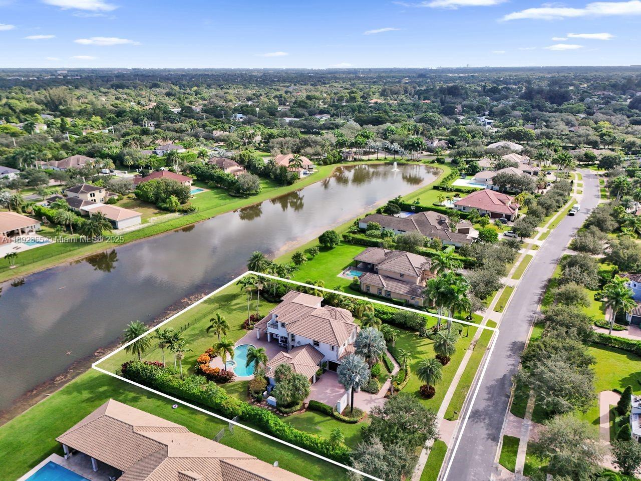 14403 Jockey Circle Davie, FL 33330 - Photo 2 of 53 an aerial view of residential houses with outdoor space